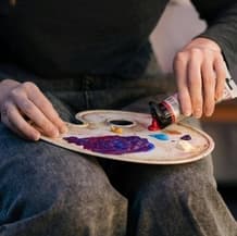 Person Mixing Colors to Paint