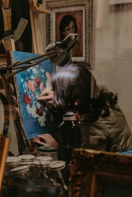 Woman Cleaning a Painting