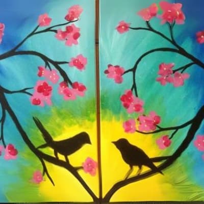 Two Birds Sitting on A Tree with Pink Leaves