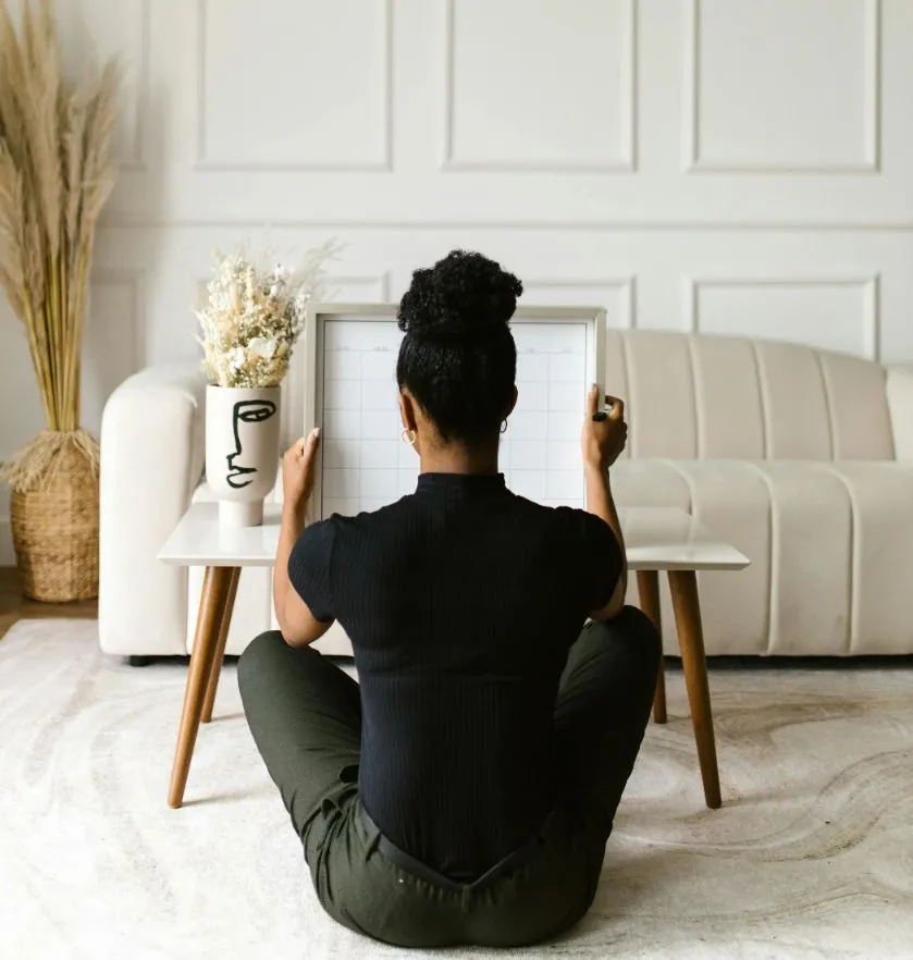 Girl Framing a Canvas Painting